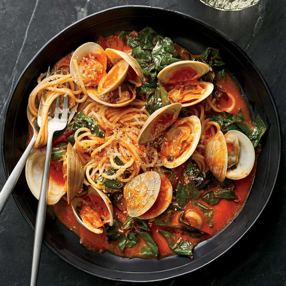 Spaghetti with clams and braised greens